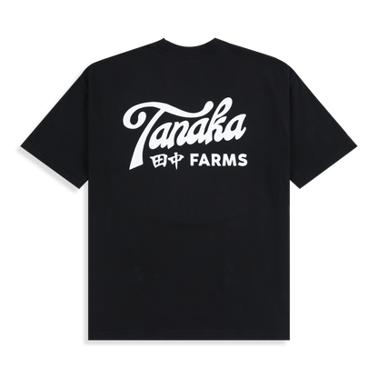 Black t-shirt with 'Tanaka Farms' logo on a white background